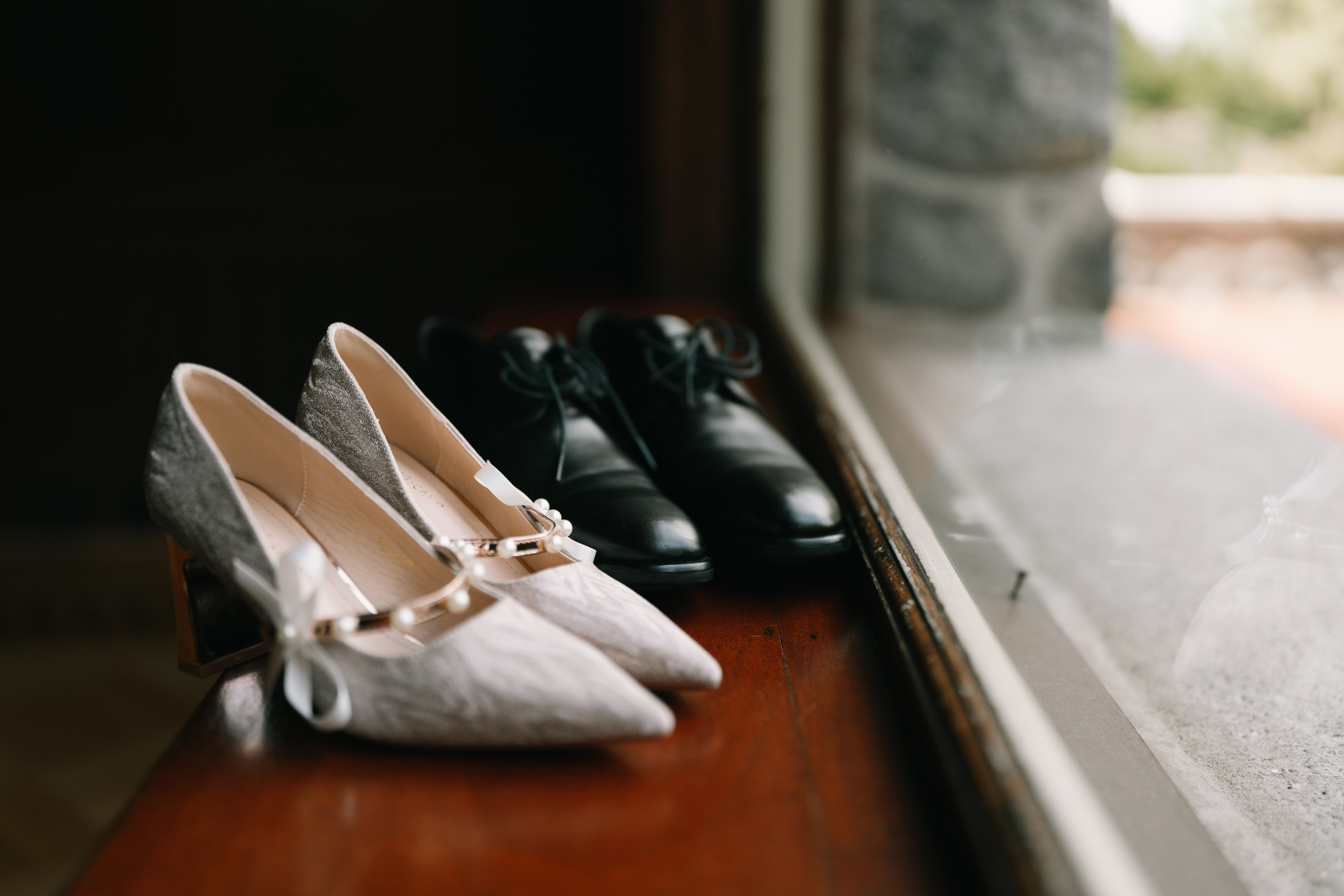 Wedding shoes in soft window light at Cecil Green Park House