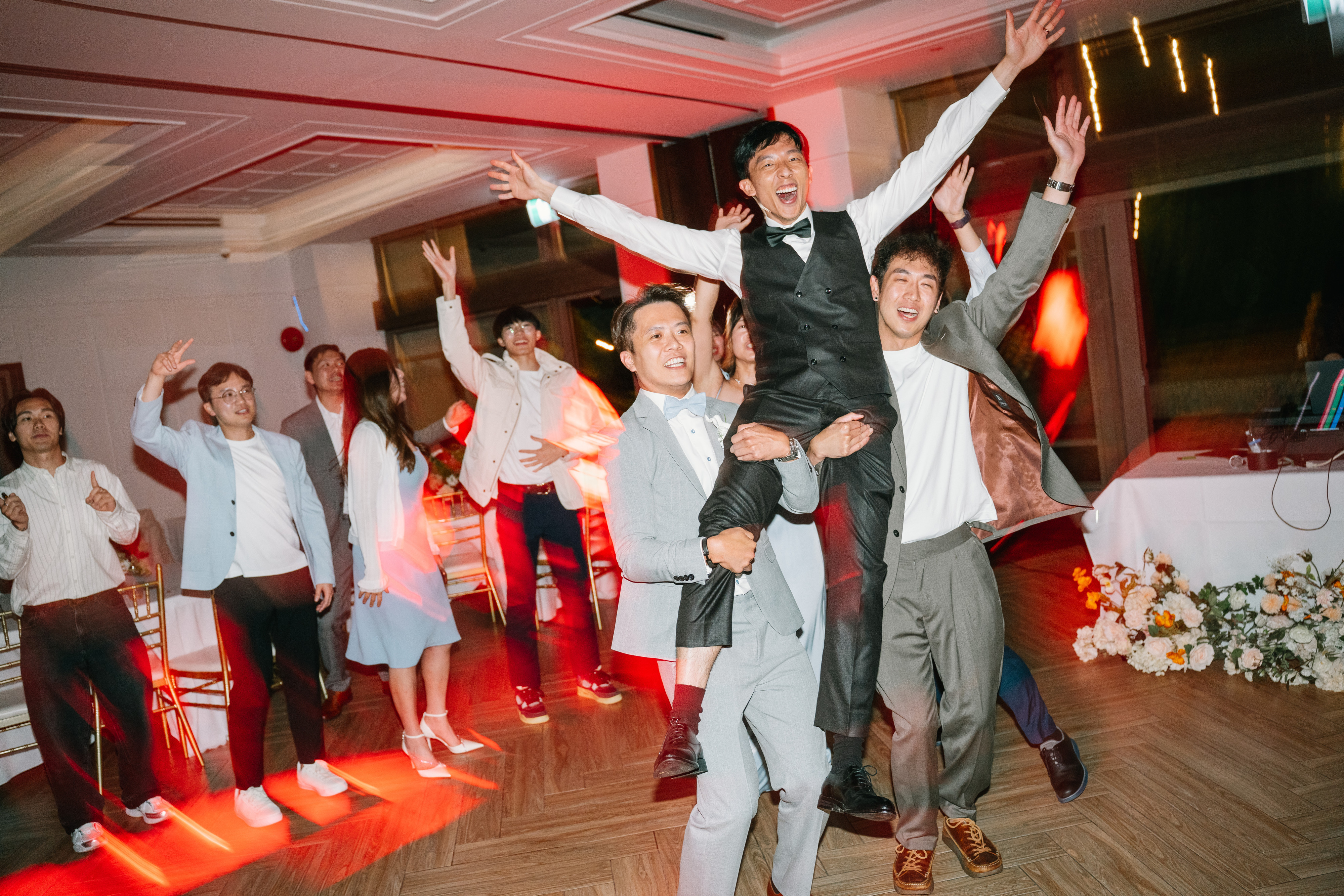Wedding guests celebrating together on the dance floor at Furry Creek