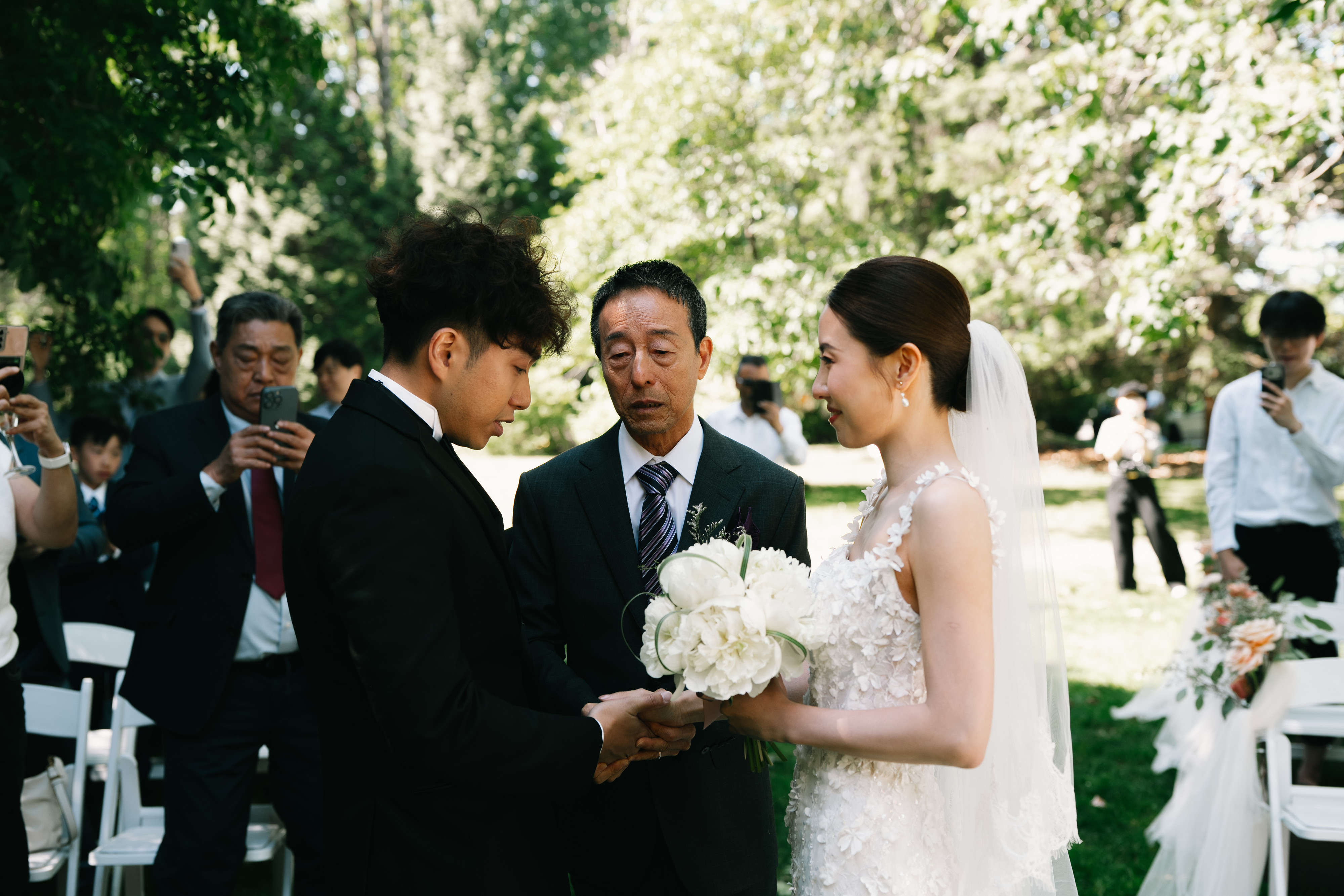Family and newlyweds together during a Stanley Park wedding ceremony